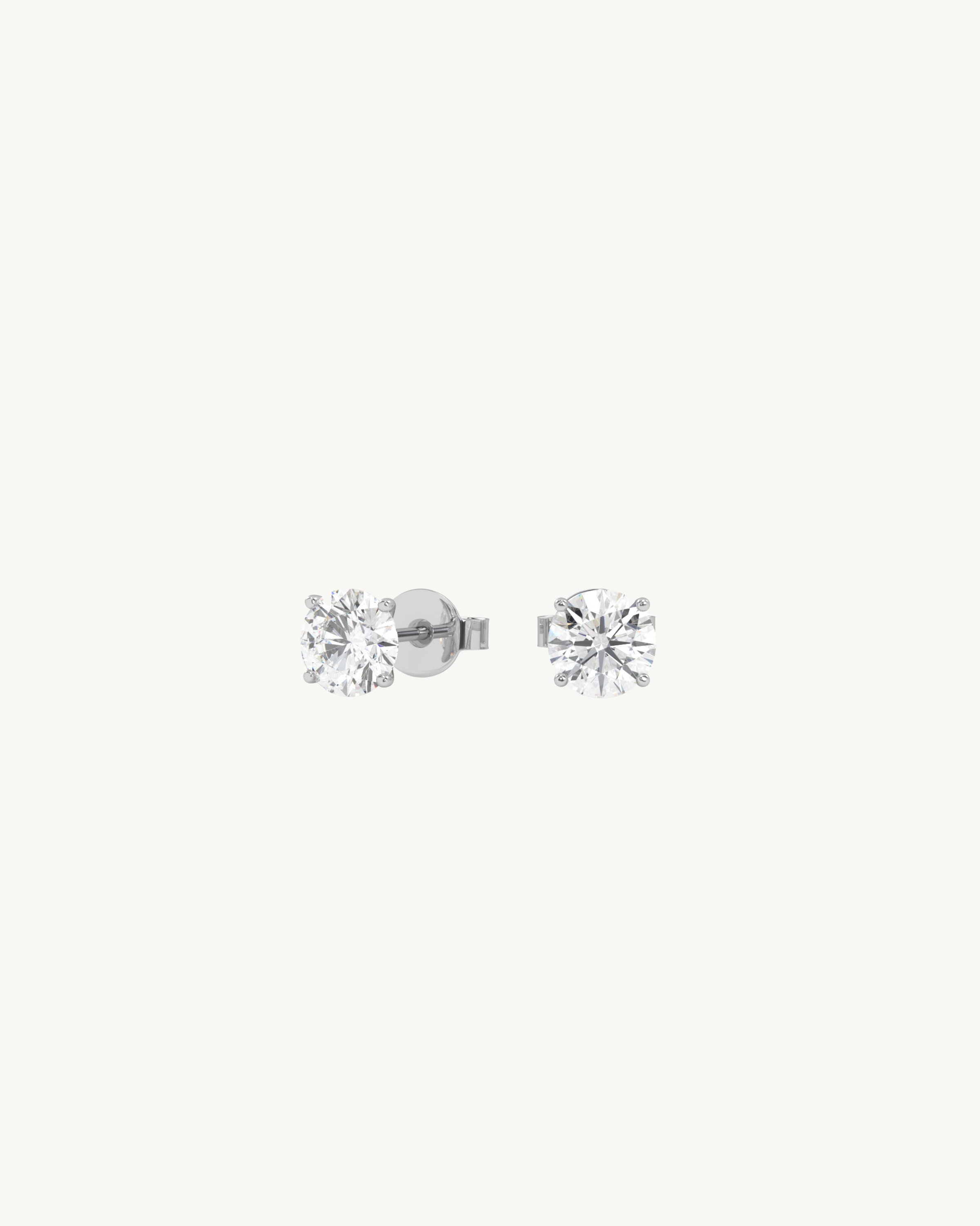 Pair of diamond stud earrings with clear gemstones on a white background