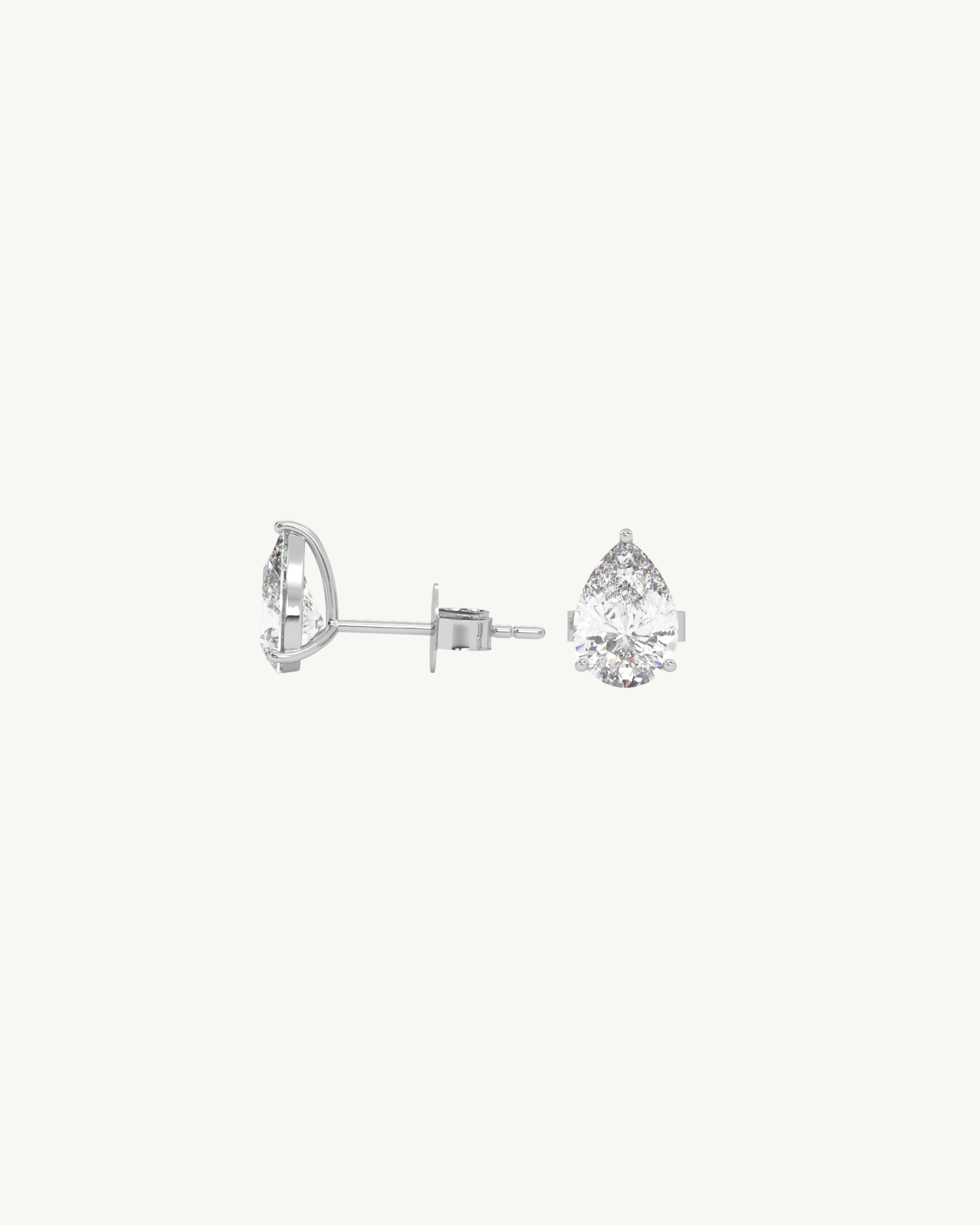 Pair of diamond stud earrings on a white background