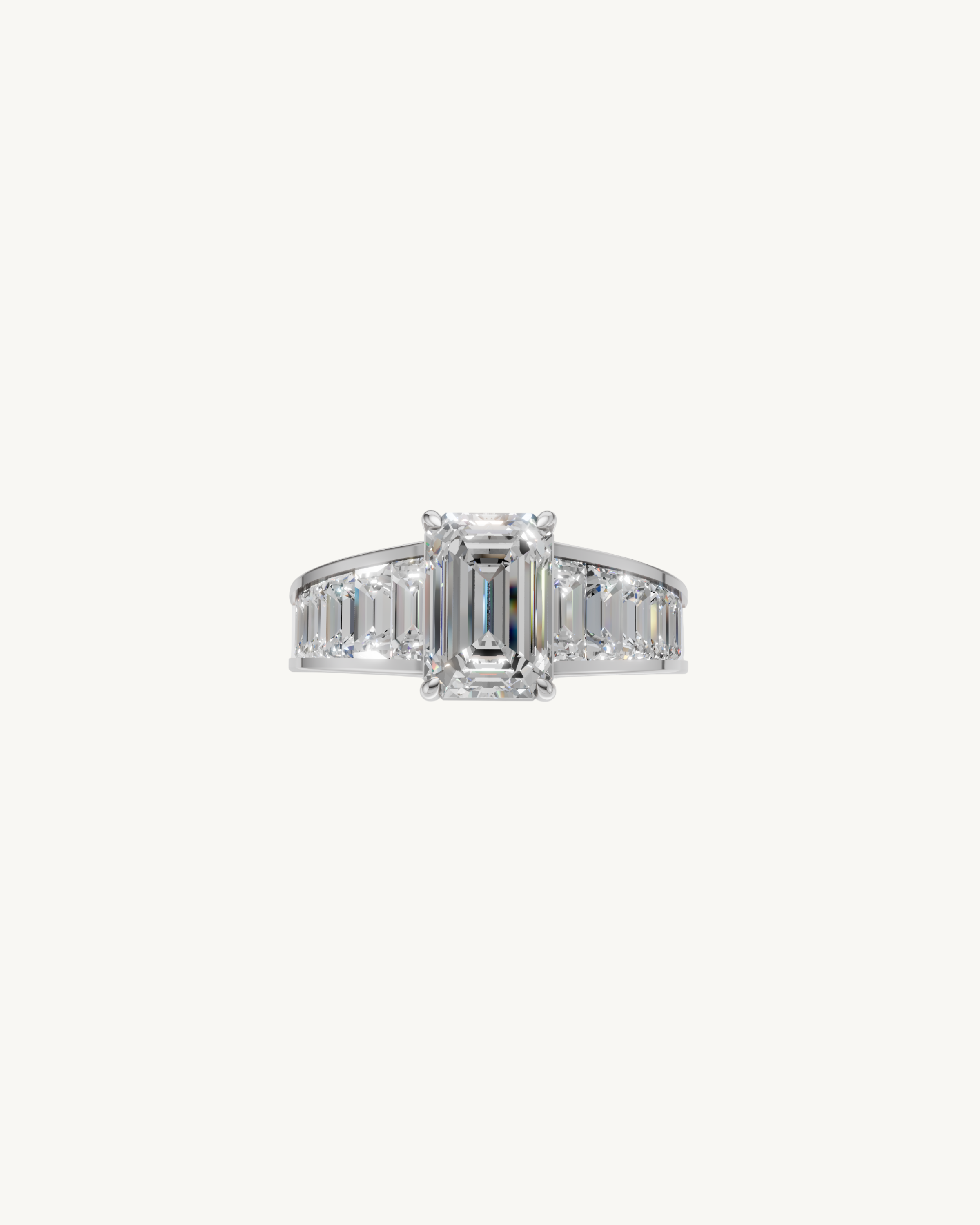 Diamond ring with emerald cut center stone and a gold band with tapered baguette diamonds