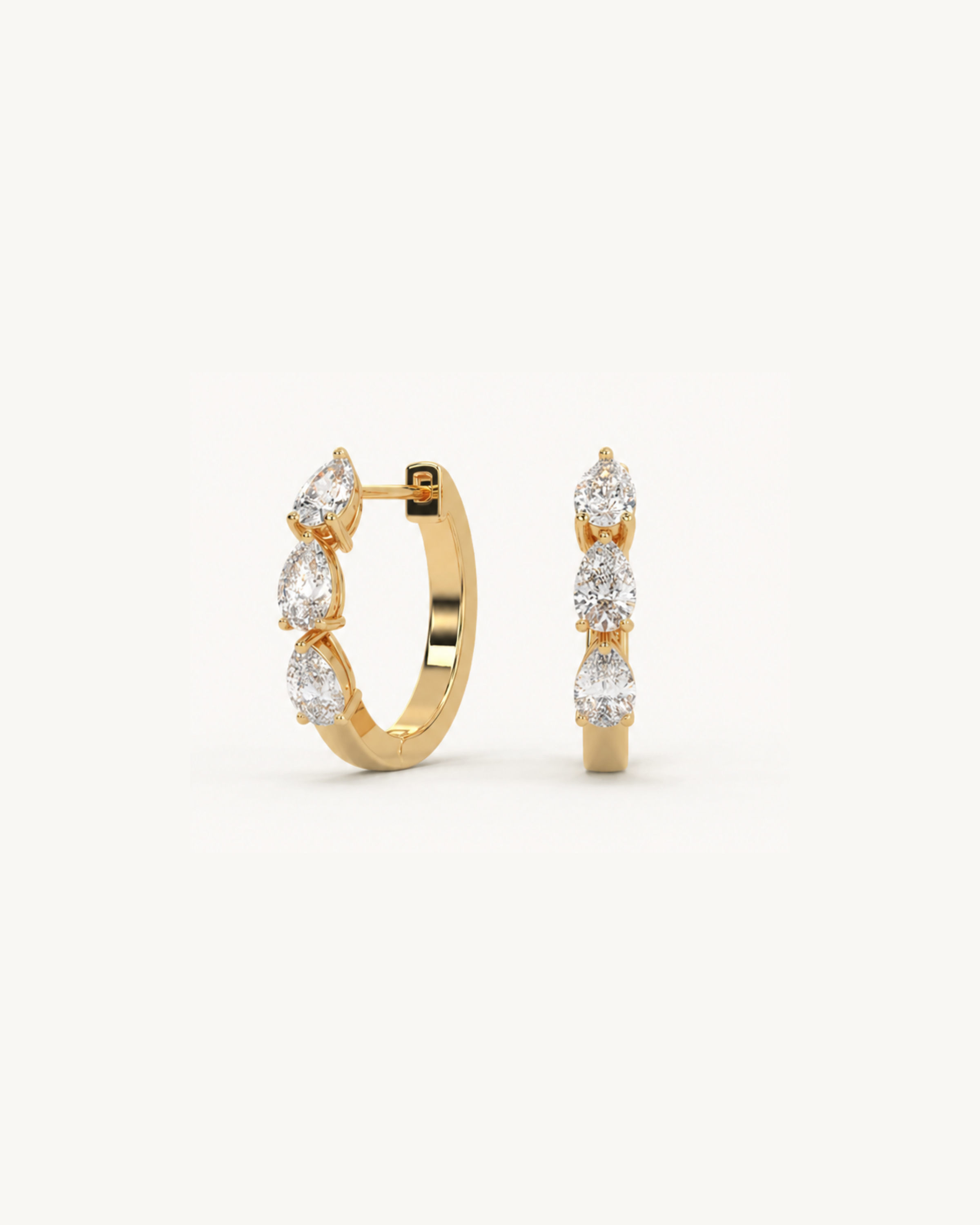 A pair of gold hoop earrings with lab-grown diamonds arranged in a flowing silhouette, resembling the shape of the horizon.