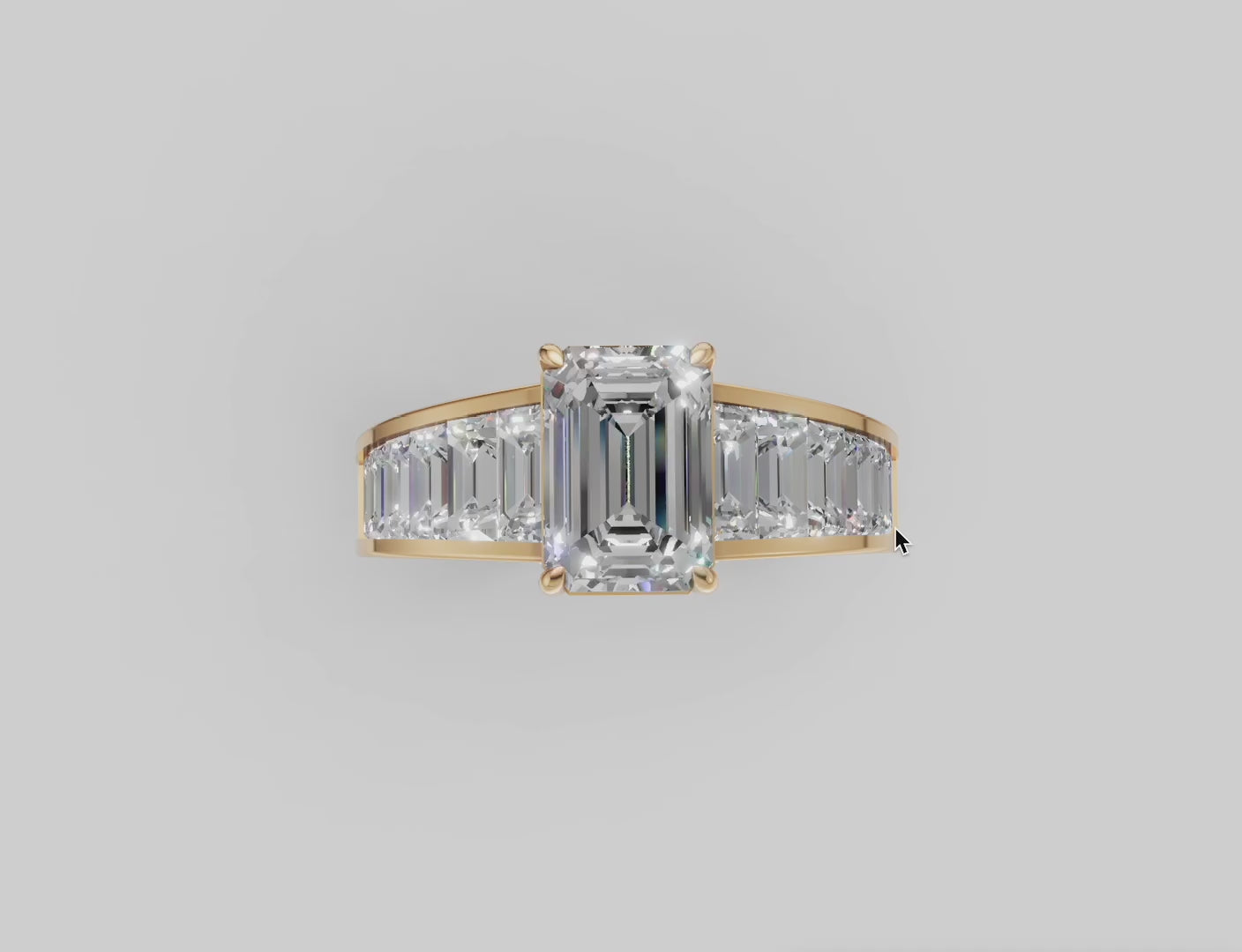 Diamond ring with emerald cut center stone and a gold band with tapered baguette diamonds